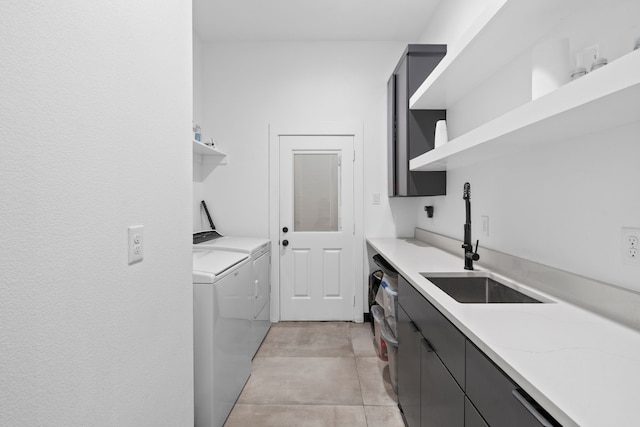 2303 Timber Creek Ct, Cedar Hill, TX 75104 - washroom with separate washer and dryer, cabinet space, and light tile patterned flooring