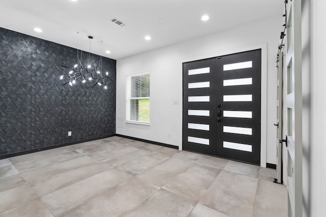 2303 Timber Creek Ct, Cedar Hill, TX 75104 - foyer entrance with an accent wall, a chandelier, recessed lighting, a barn door, and baseboards