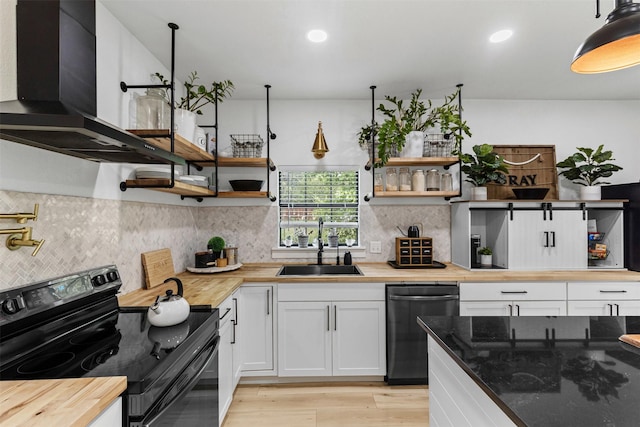 207 W River, Meridian, TX 76665 - kitchen with black electric range, dishwasher, open shelves, wooden counters, and recessed lighting