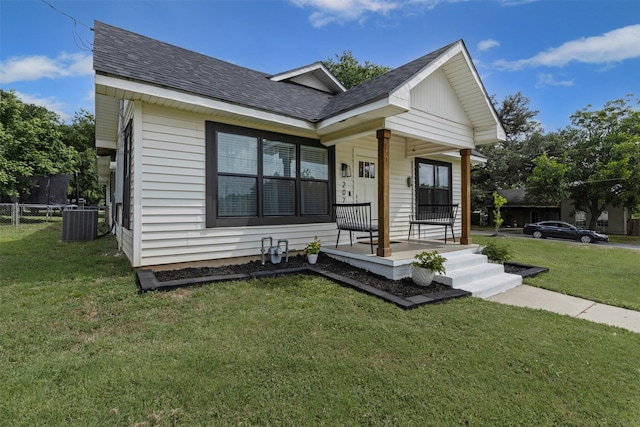 207 W River, Meridian, TX 76665 - view of front facade with a porch, roof with shingles, and central AC unit