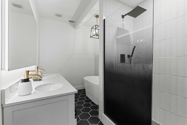 207 W River, Meridian, TX 76665 - full bath with double vanity, a walk in shower, a freestanding bath, and tile patterned flooring