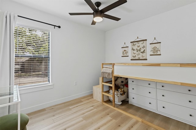 207 W River, Meridian, TX 76665 - bedroom featuring light wood finished floors, baseboards, and ceiling fan
