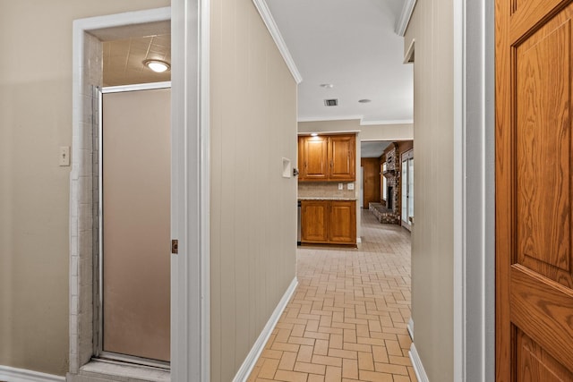 1108 Quitman St, Pittsburg, TX 75686 - hall featuring brick patterned floors and crown molding