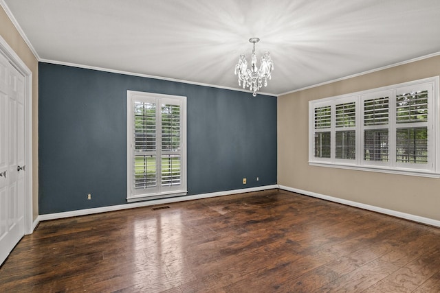 1108 Quitman St, Pittsburg, TX 75686 - unfurnished room featuring a chandelier, crown molding, baseboards, and wood finished floors