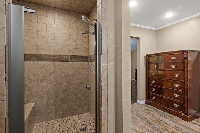 1108 Quitman St, Pittsburg, TX 75686 - full bath with crown molding, a stall shower, and wood finished floors