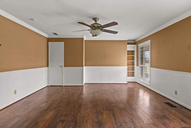 1108 Quitman St, Pittsburg, TX 75686 - empty room with wainscoting, ceiling fan, wood finished floors, and crown molding