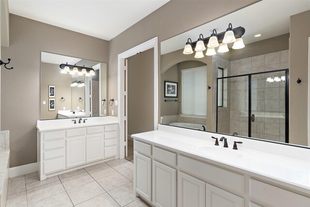 843 Bear Crossing Dr, Allen, TX 75013 - bathroom with a shower stall, vanity, a garden tub, tile patterned flooring, and baseboards