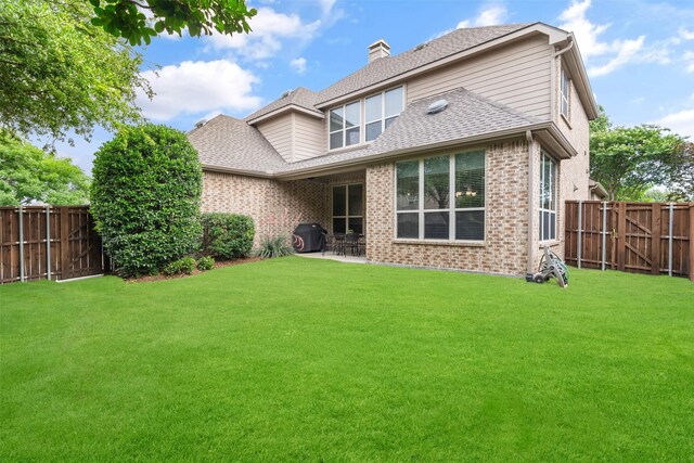 843 Bear Crossing Dr, Allen, TX 75013 - rear view of property featuring a chimney, a patio, brick siding, and a shingled roof