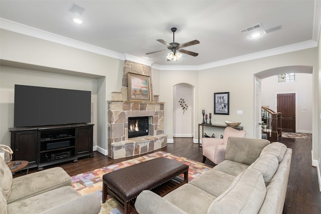 843 Bear Crossing Dr, Allen, TX 75013 - living area featuring arched walkways, crown molding, ceiling fan, baseboards, and a fireplace