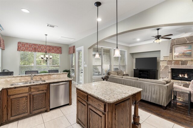 843 Bear Crossing Dr, Allen, TX 75013 - kitchen with dishwasher, a sink, light tile patterned floors, a chandelier, and pendant lighting