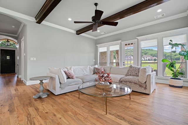1803 Sunset Xing, Cedar Hill, TX 75104 - living room with beam ceiling, a ceiling fan, wood finished floors, arched walkways, and baseboards