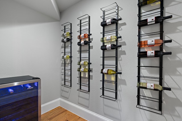 1803 Sunset Xing, Cedar Hill, TX 75104 - wine room with beverage cooler, wood finished floors, and baseboards