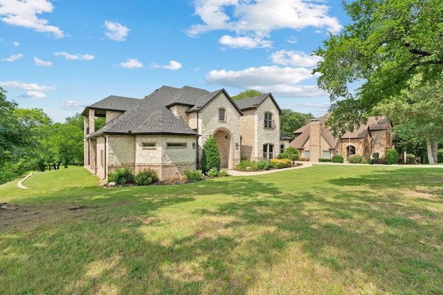1803 Sunset Xing, Cedar Hill, TX 75104 - french country style house featuring stone siding, a front lawn, brick siding, and a shingled roof
