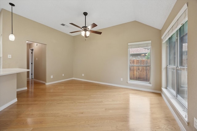 6404 Westgate Dr, North Richland Hills, TX 76182 - spare room featuring ceiling fan, lofted ceiling, and light wood finished floors