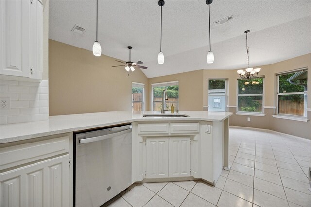 6404 Westgate Dr, North Richland Hills, TX 76182 - kitchen with dishwasher, a textured ceiling, light tile patterned floors, tasteful backsplash, and white cabinets