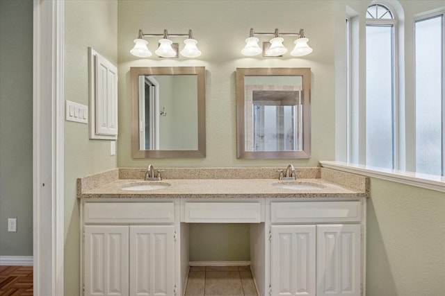 6404 Westgate Dr, North Richland Hills, TX 76182 - bathroom with double vanity and baseboards