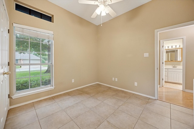 6404 Westgate Dr, North Richland Hills, TX 76182 - unfurnished room with light tile patterned floors, a ceiling fan, and plenty of natural light
