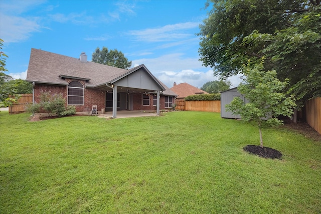 6404 Westgate Dr, North Richland Hills, TX 76182 - back of house featuring brick siding, a patio, a storage unit, a fenced backyard, and roof with shingles