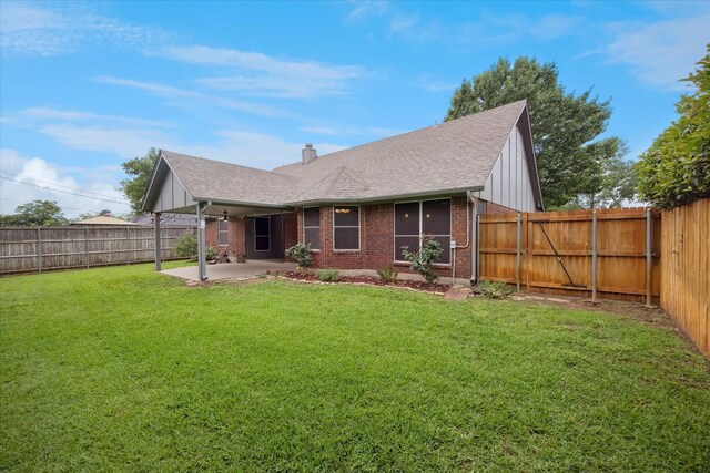 6404 Westgate Dr, North Richland Hills, TX 76182 - rear view of house with brick siding, a patio area, roof with shingles, and a fenced backyard