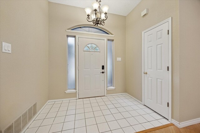 6404 Westgate Dr, North Richland Hills, TX 76182 - entrance foyer featuring a chandelier and baseboards