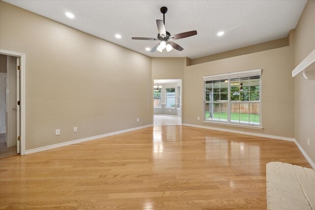 6404 Westgate Dr, North Richland Hills, TX 76182 - empty room with ceiling fan, light wood-type flooring, recessed lighting, and a chandelier