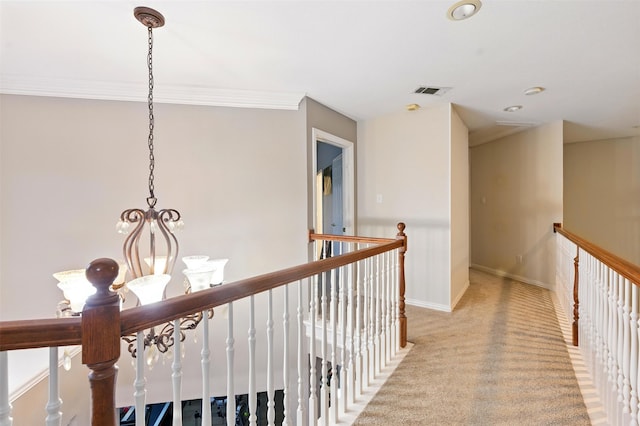 606 Eagle Ct, Keller, TX 76248 - corridor featuring light carpet, an upstairs landing, ornamental molding, baseboards, and a chandelier