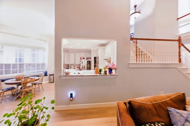 606 Eagle Ct, Keller, TX 76248 - sitting room featuring wood finished floors, baseboards, and stairs