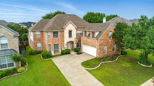 606 Eagle Ct, Keller, TX 76248 - colonial-style house with brick siding, concrete driveway, a chimney, a front lawn, and an attached garage