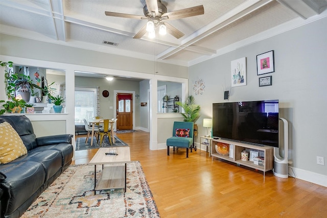 2108 Fairmount Ave, Fort Worth, TX 76110 - living room featuring coffered ceiling, light wood finished floors, ceiling fan, baseboards, and beam ceiling
