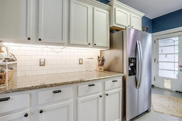 2108 Fairmount Ave, Fort Worth, TX 76110 - kitchen featuring stainless steel fridge with ice dispenser, white cabinetry, healthy amount of natural light, and backsplash