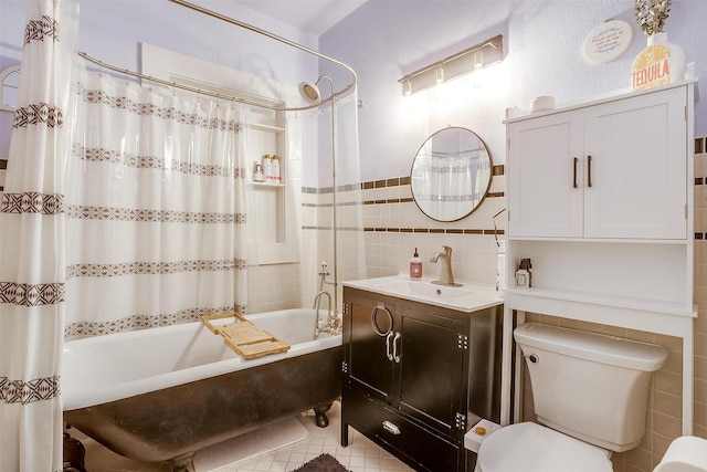 2108 Fairmount Ave, Fort Worth, TX 76110 - full bathroom featuring tile walls, shower / bathtub combination with curtain, vanity, toilet, and tile patterned flooring