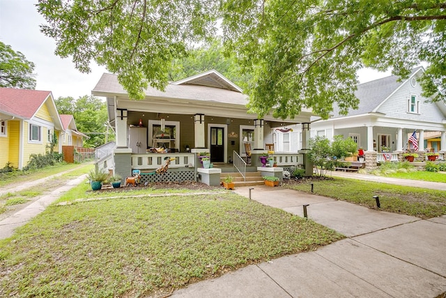2108 Fairmount Ave, Fort Worth, TX 76110 - view of front facade with a porch and a front lawn