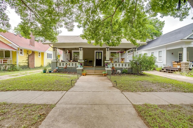 2108 Fairmount Ave, Fort Worth, TX 76110 - view of front of home featuring a porch and a front yard