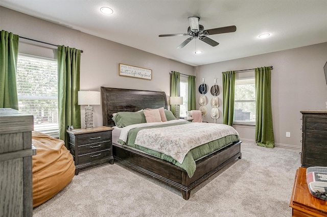 1107 Perkins Rd, Poolville, TX 76487 - bedroom featuring multiple windows, light carpet, recessed lighting, ceiling fan, and baseboards