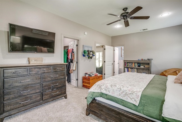 1107 Perkins Rd, Poolville, TX 76487 - bedroom with light carpet, a walk in closet, a closet, and ceiling fan
