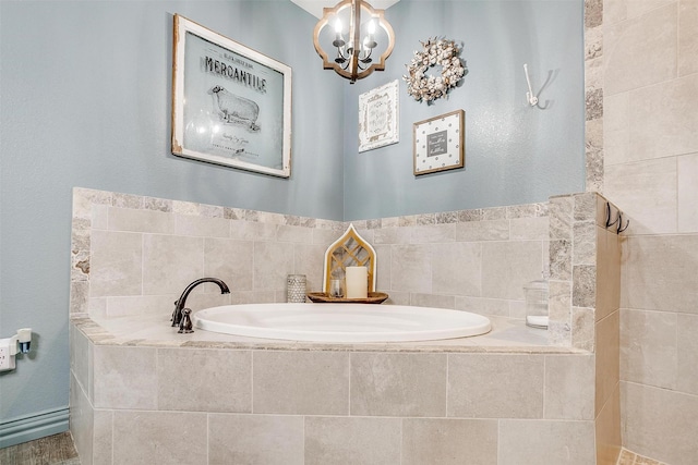 1107 Perkins Rd, Poolville, TX 76487 - bathroom with a bath and a chandelier