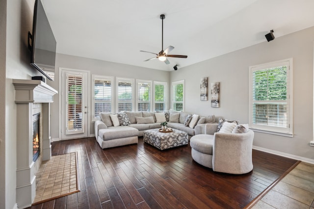 2707 Barnhill Ln, Frisco, TX 75034 - living area featuring ceiling fan, plenty of natural light, a glass covered fireplace, baseboards, and lofted ceiling