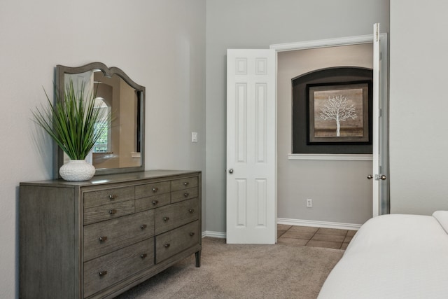 2707 Barnhill Ln, Frisco, TX 75034 - tiled bedroom with baseboards and carpet floors