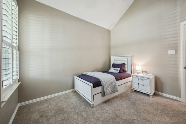 2707 Barnhill Ln, Frisco, TX 75034 - bedroom featuring multiple windows, light carpet, lofted ceiling, and baseboards