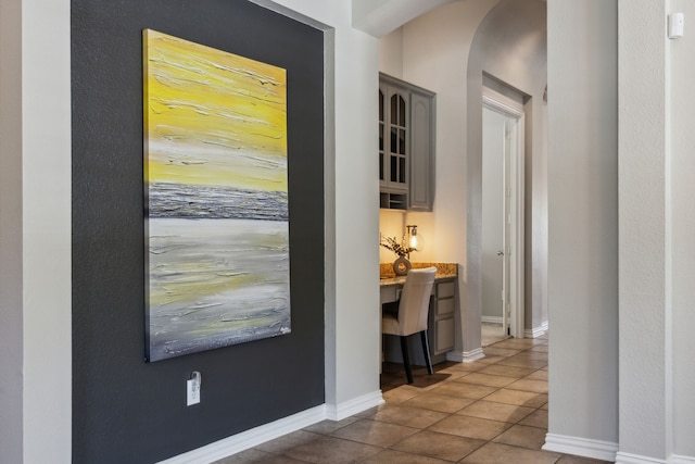 2707 Barnhill Ln, Frisco, TX 75034 - corridor featuring arched walkways, tile patterned floors, and baseboards