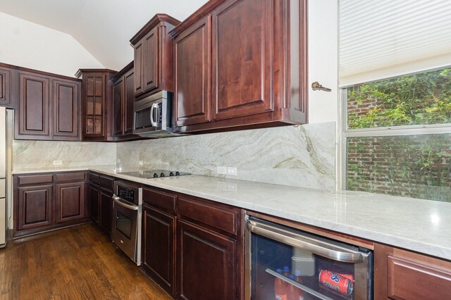 1416 Tangle Ridge Dr, Mckinney, TX 75071 - kitchen with stainless steel appliances, wine cooler, dark wood finished floors, vaulted ceiling, and backsplash