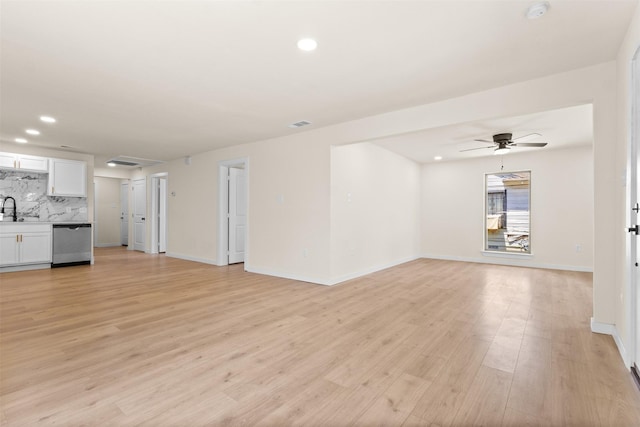 2634 Macon St, Dallas, TX 75215 - unfurnished living room with light wood-style floors, a ceiling fan, and recessed lighting