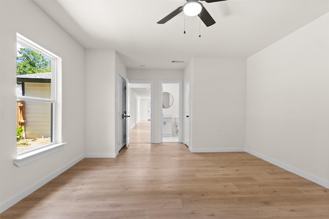2634 Macon St, Dallas, TX 75215 - unfurnished room featuring a ceiling fan and light wood-style floors