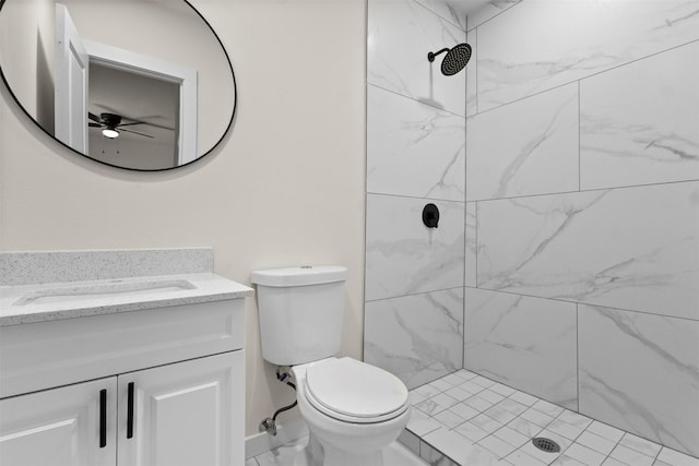 2634 Macon St, Dallas, TX 75215 - full bathroom featuring vanity, ceiling fan, tiled shower, and marble finish floors