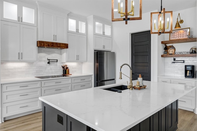 2418 Spirit Ct, Tolar, TX 76476 - kitchen featuring a sink, freestanding refrigerator, open shelves, and white cabinetry