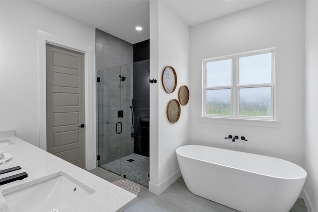 2418 Spirit Ct, Tolar, TX 76476 - bathroom with a shower stall, a soaking tub, double vanity, recessed lighting, and baseboards