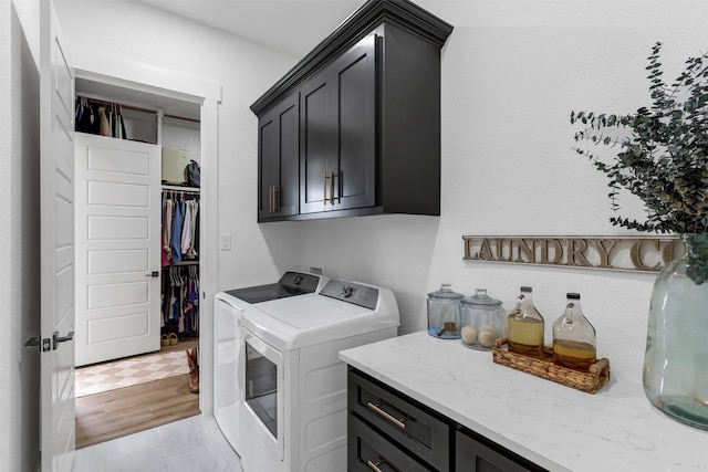 2418 Spirit Ct, Tolar, TX 76476 - laundry area with cabinet space and washing machine and clothes dryer