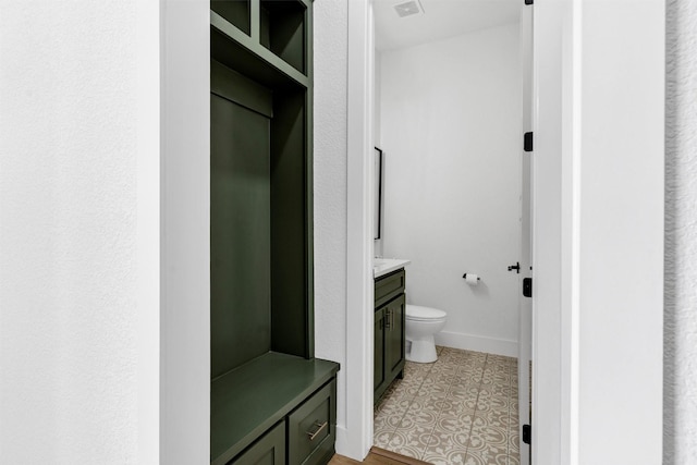 2418 Spirit Ct, Tolar, TX 76476 - bathroom featuring vanity, toilet, and baseboards