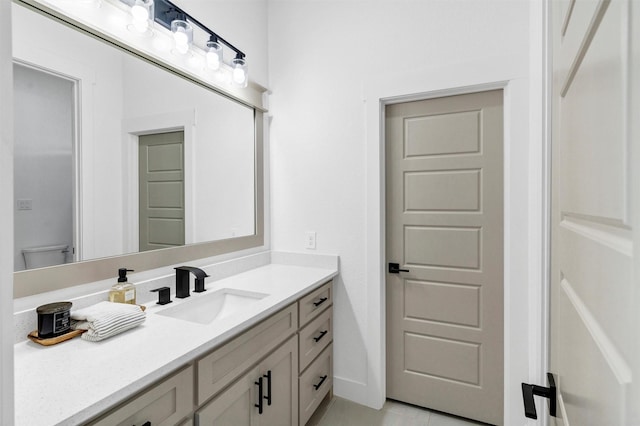2418 Spirit Ct, Tolar, TX 76476 - bathroom featuring vanity, toilet, tile patterned floors, and baseboards