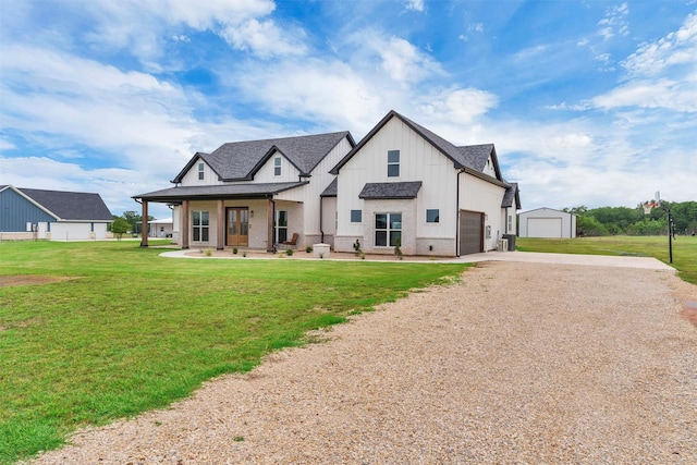 2418 Spirit Ct, Tolar, TX 76476 - view of front of house with concrete driveway, covered porch, a front lawn, board and batten siding, and an attached garage